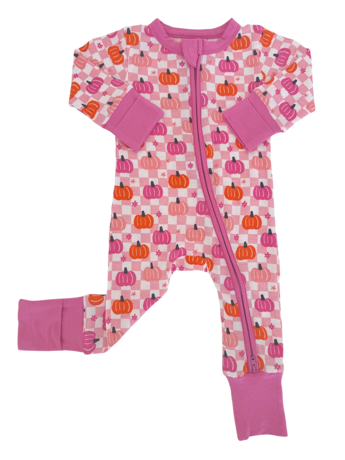 Pink pajama onesie with pumpkin patterns and purple cuffs, featuring a full front zipper.