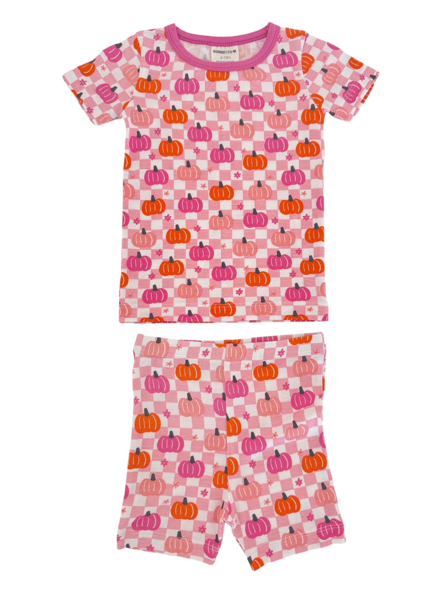 Pink pajamas with colorful pumpkin patterns, featuring a short-sleeve top and matching shorts.