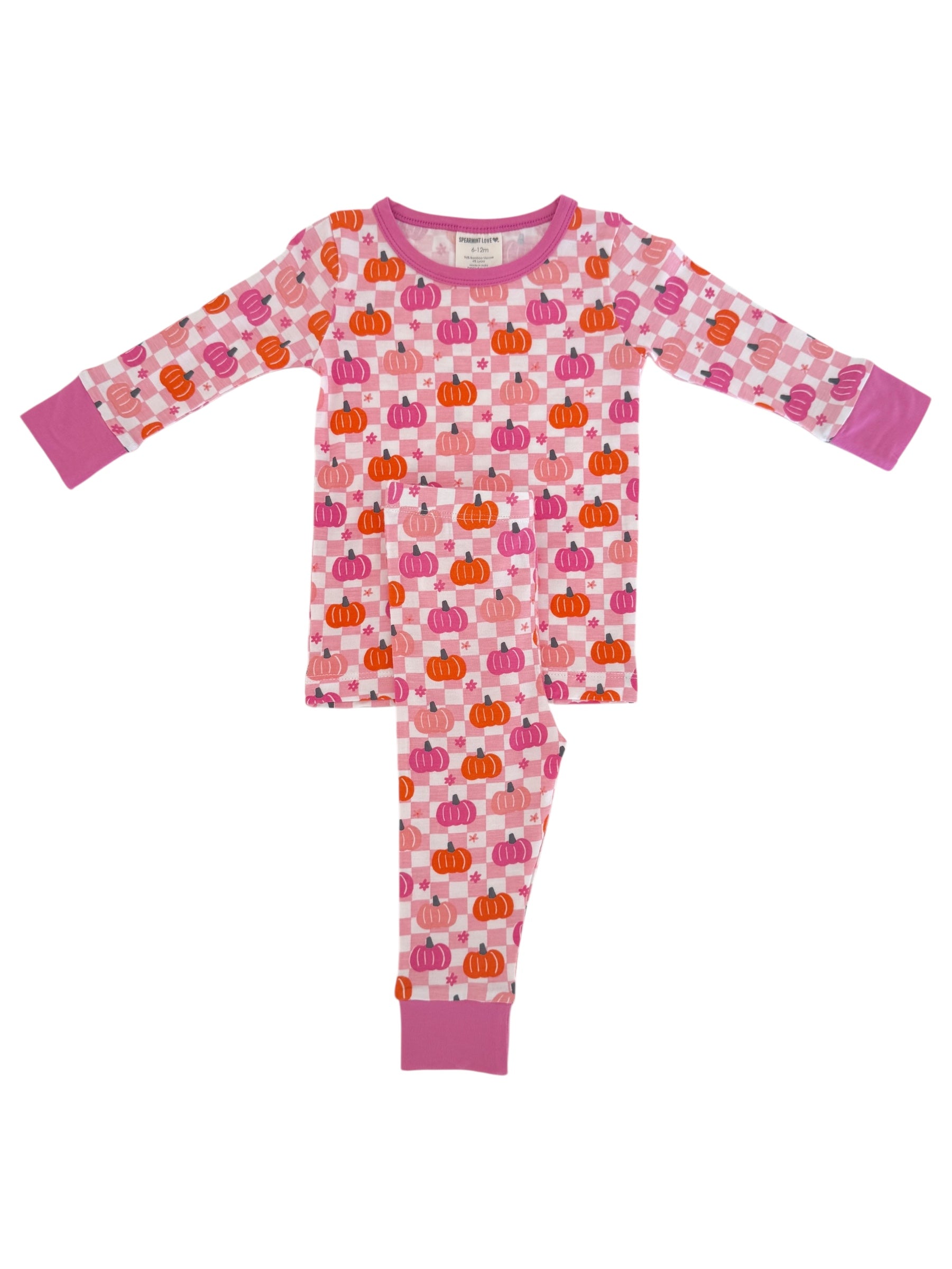Pink pajama set featuring a playful pumpkin pattern, ideal for cozy nights and seasonal fun.