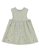 Light green sleeveless dress with a flared skirt and patterned circles in soft colors.