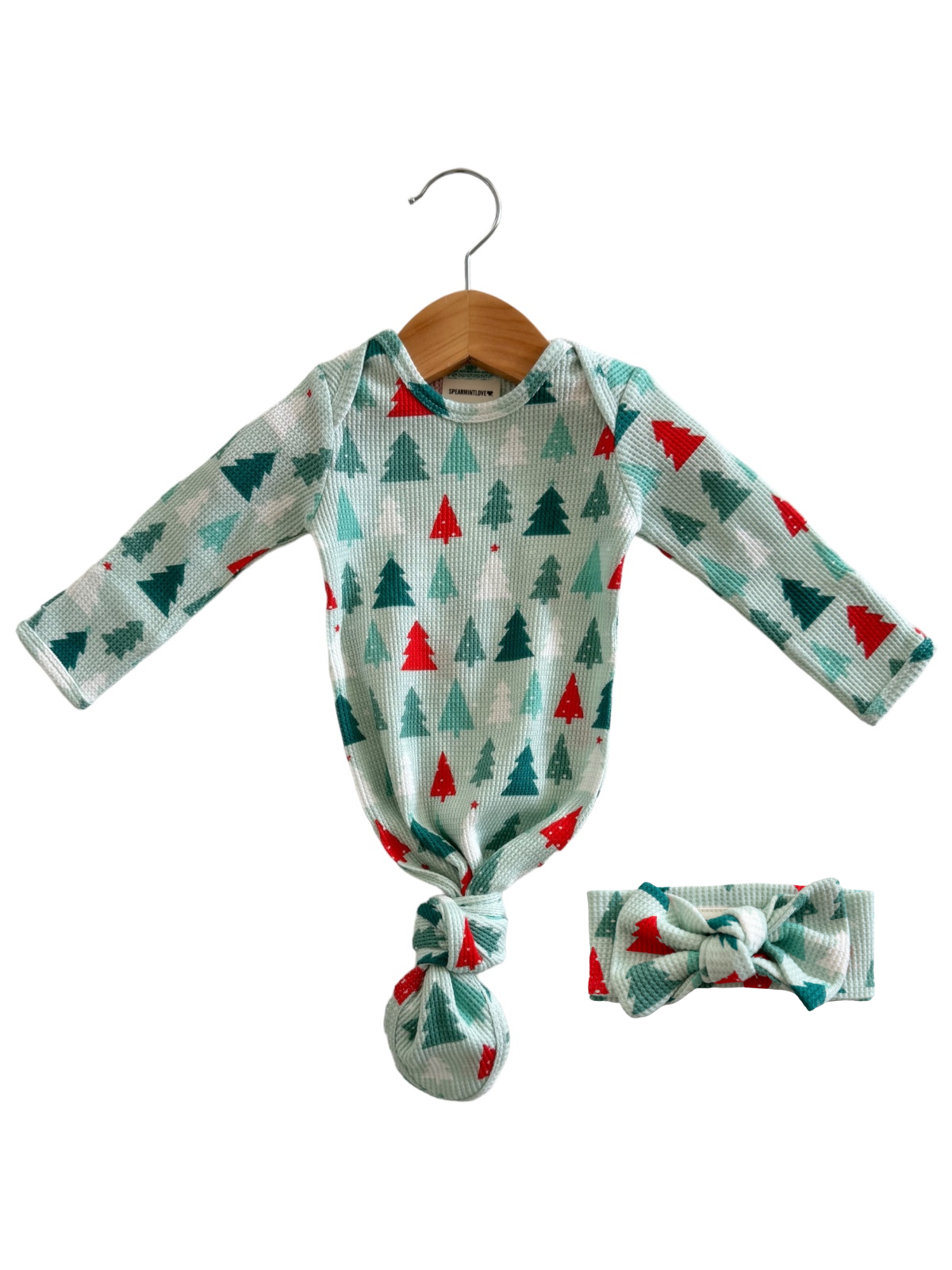 Baby outfit with long sleeves featuring green and red trees, plus a matching headband.