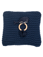 Navy knitted pillow with a whale design and wooden ring, featuring a dark pom-pom accent.