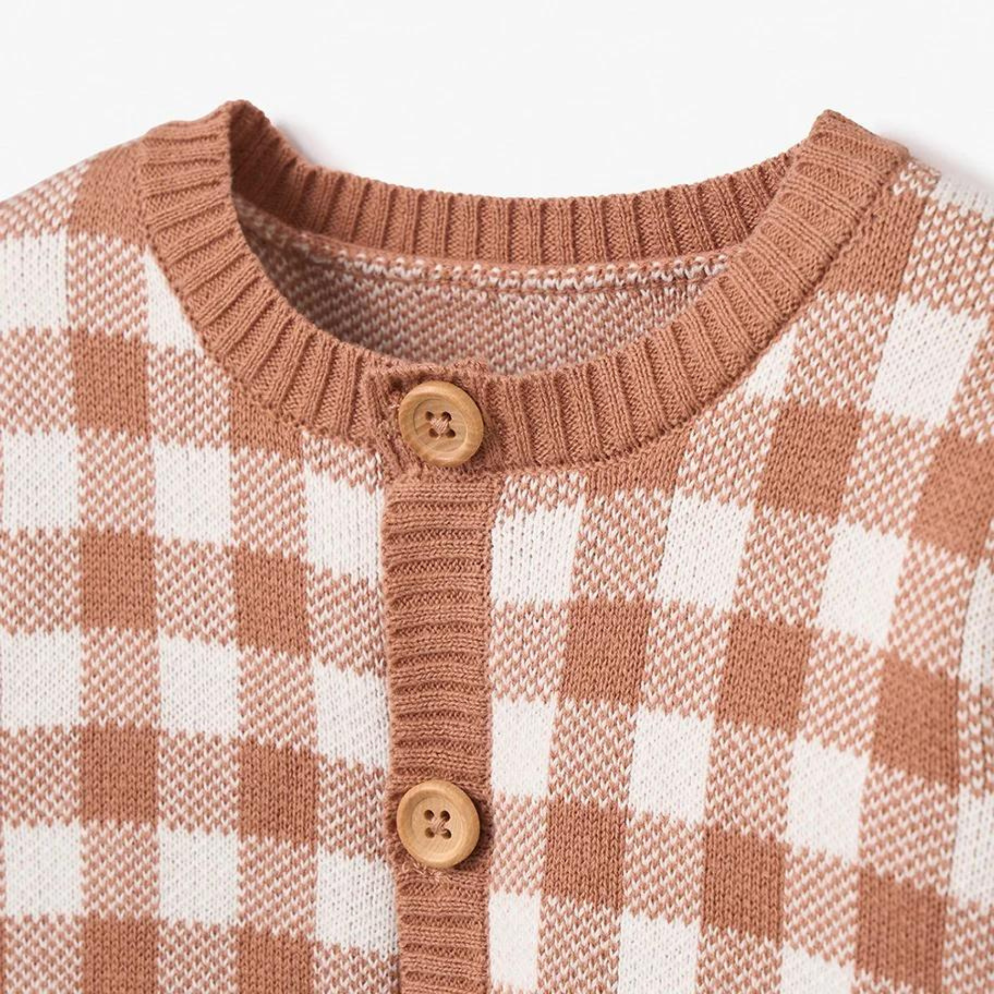 Light brown and white checkered cardigan with wooden buttons and a round neckline.