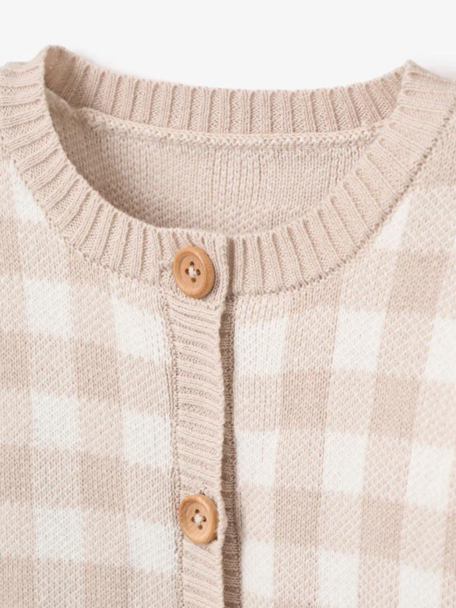 Beige and white checkered cardigan with wooden buttons and ribbed collar detail.