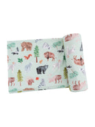 Light green fabric featuring playful watercolor illustrations of various animals and trees.