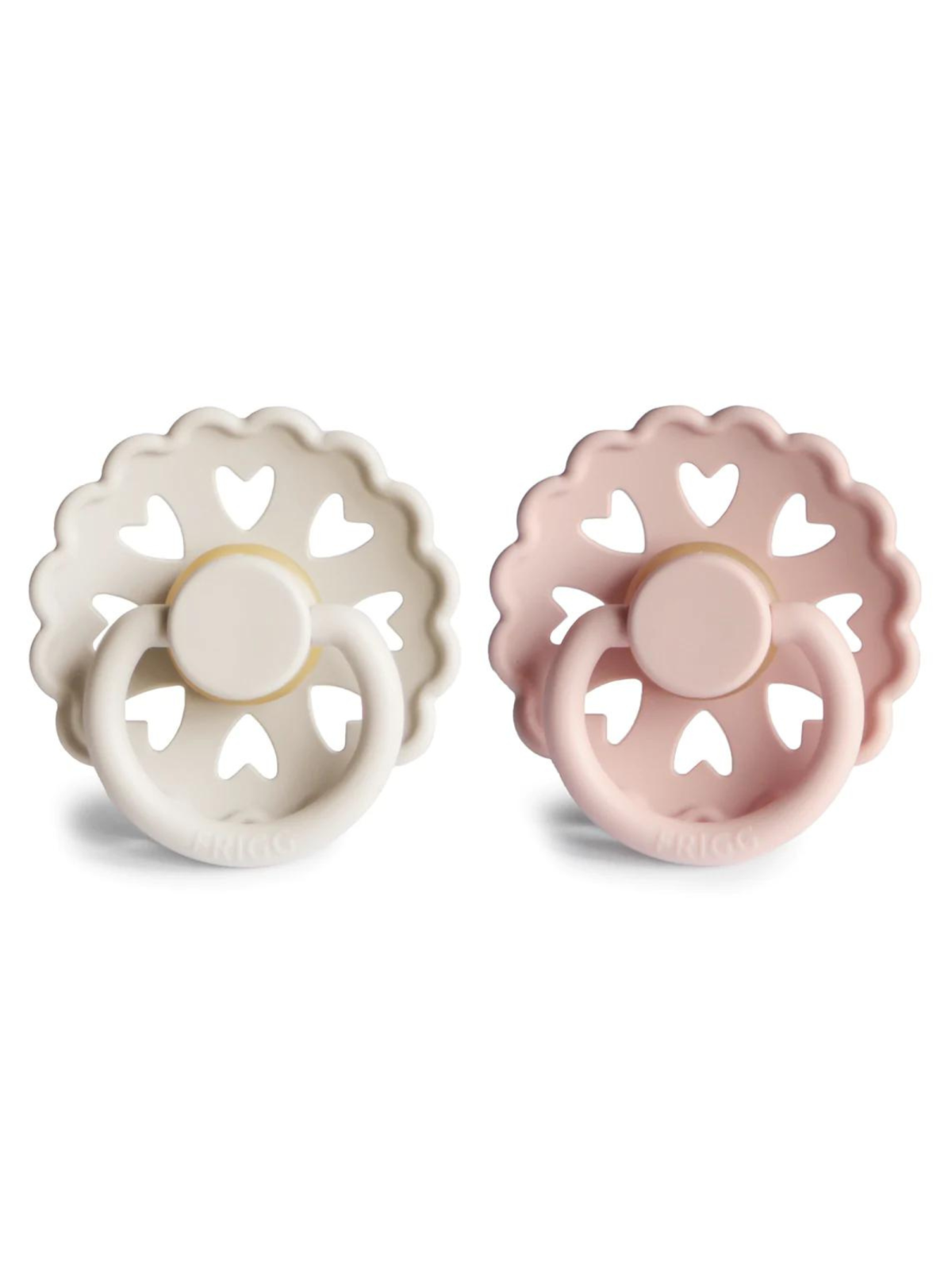 Two silicone baby pacifiers in white and pink, featuring heart-shaped cutouts and a round handle.