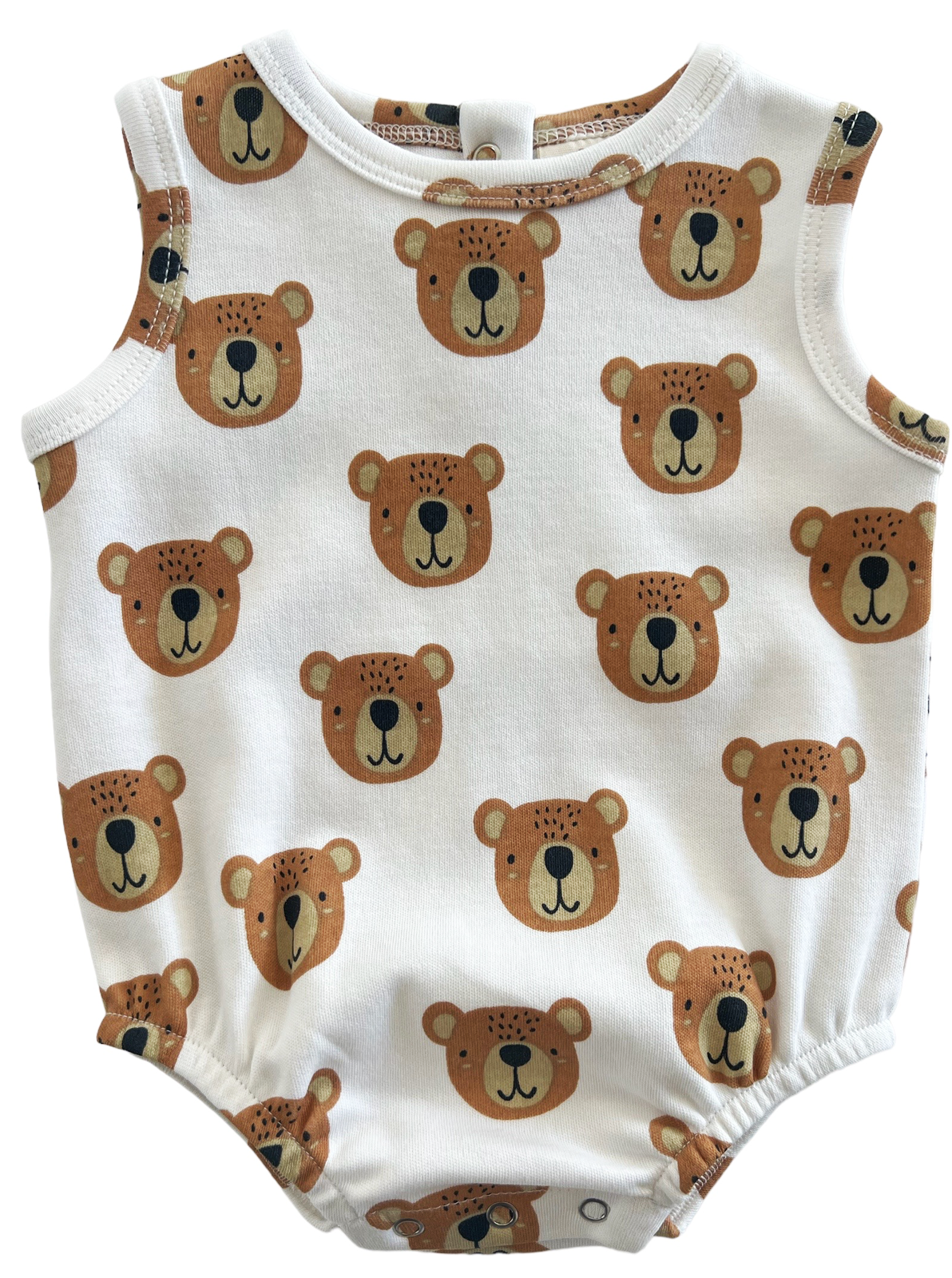 White onesie with a pattern of bear faces in brown and tan colors, featuring snaps at the bottom.
