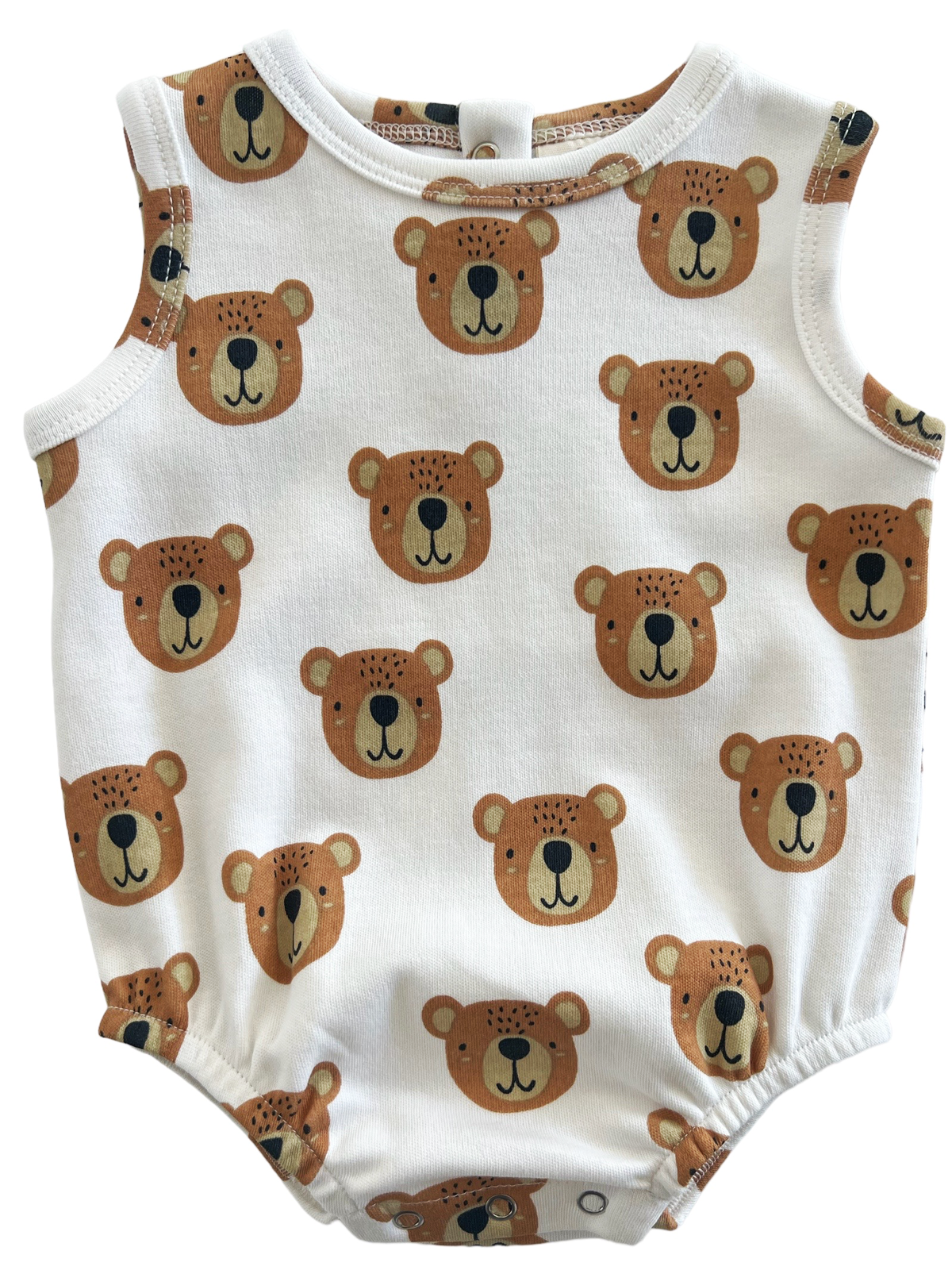 White onesie with a pattern of bear faces in brown and tan colors, featuring snaps at the bottom.