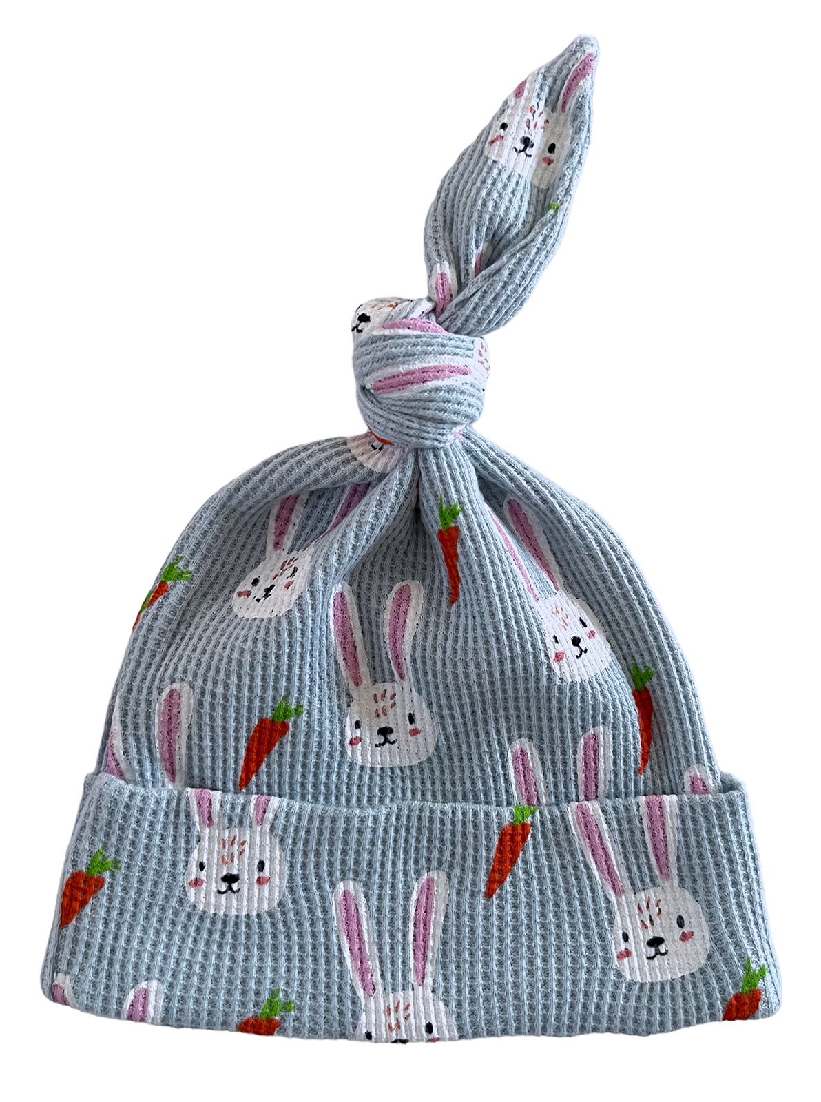 Light blue baby hat with bunny and carrot print, featuring a knotted top design.