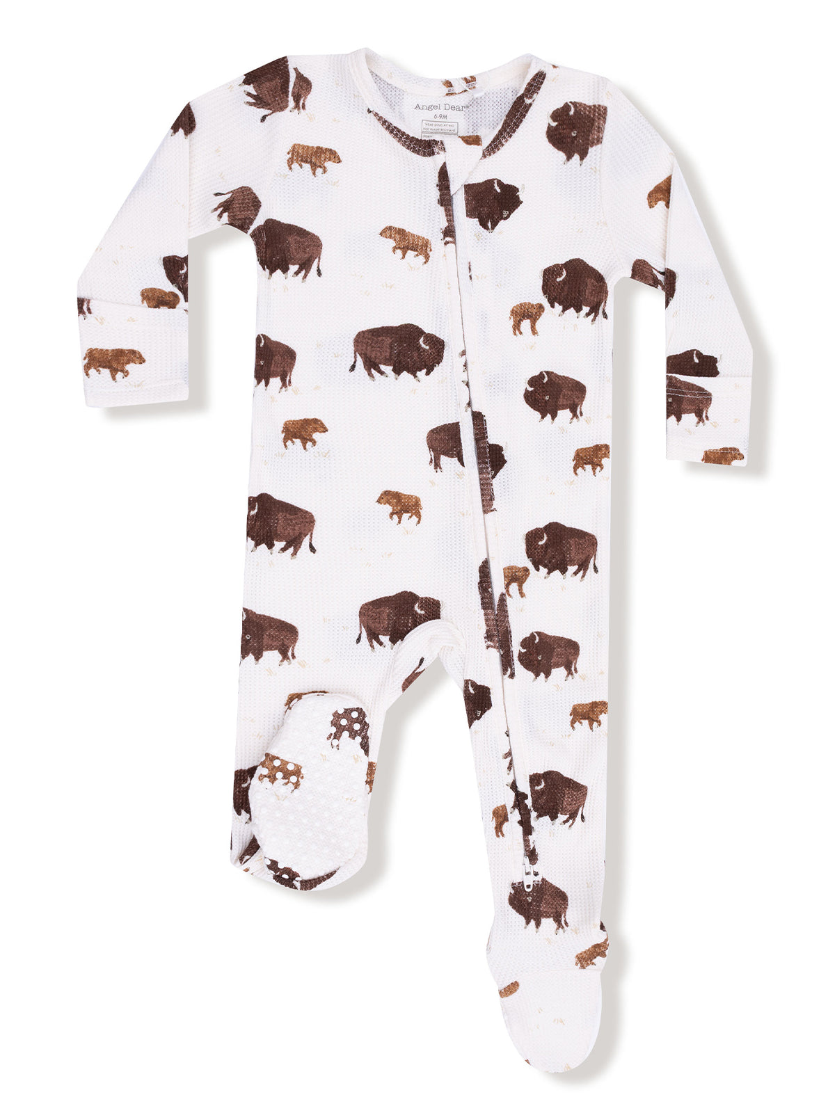 White one-piece pajama with a bison print in brown, featuring long sleeves and footed design.