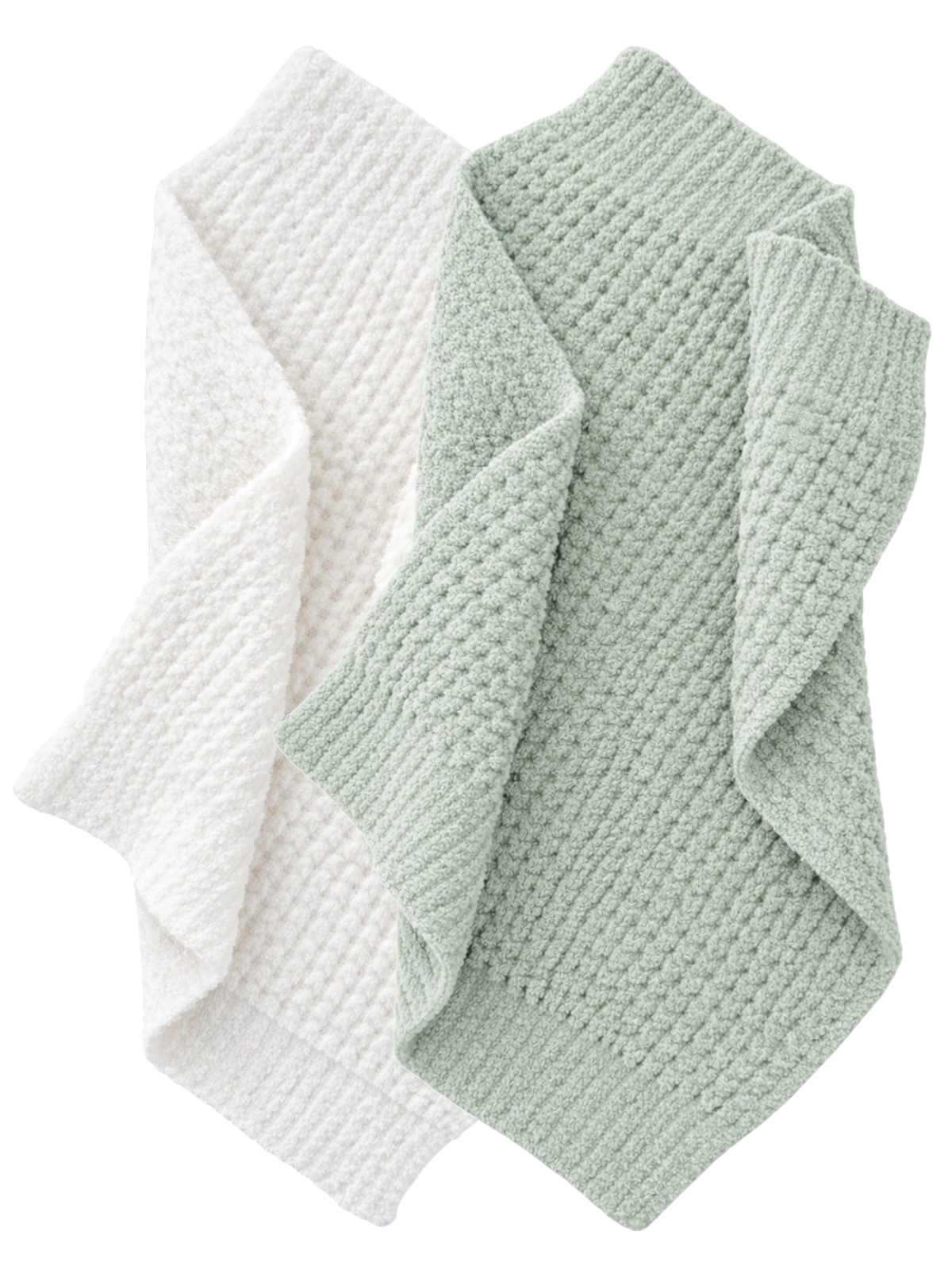 Two textured blankets, one white and one light green, folded and overlapping on a white background.