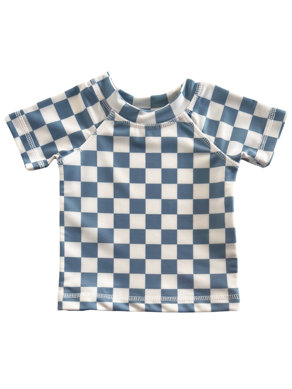 Blue and white checkered short-sleeve shirt laid flat, showcasing a playful and modern design.