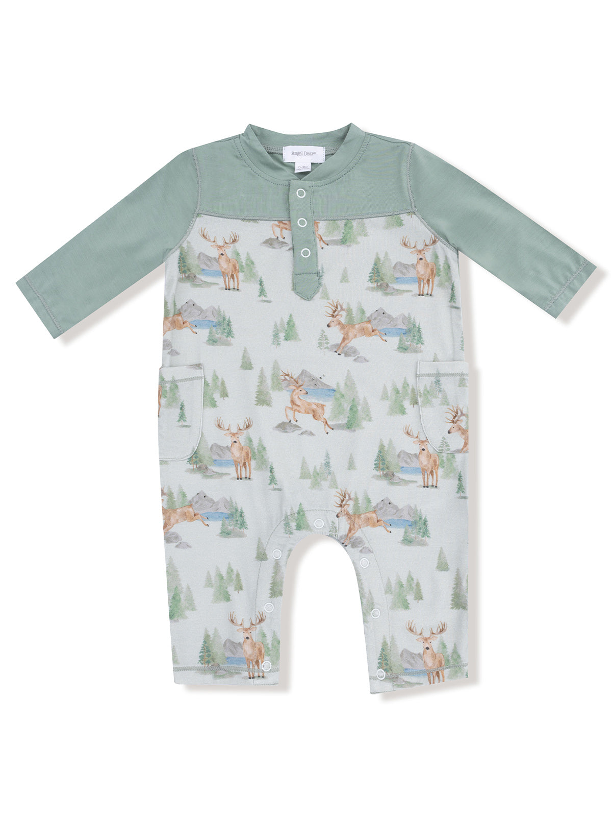 Green long-sleeve romper with animal and nature print, featuring button closure and two front pockets.