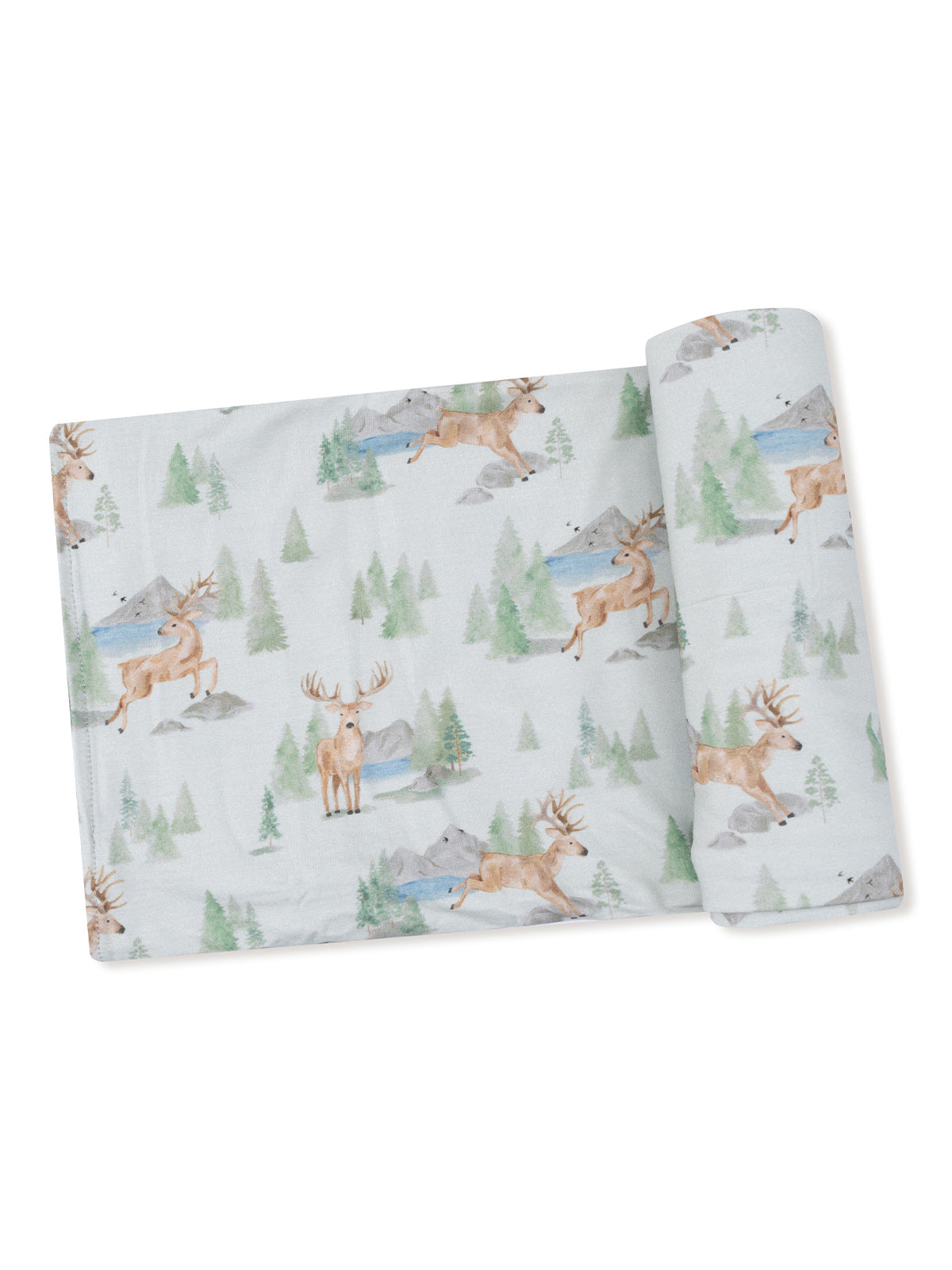 Patterned fabric featuring deer and scenic landscapes of trees, mountains, and water in a soft color palette.