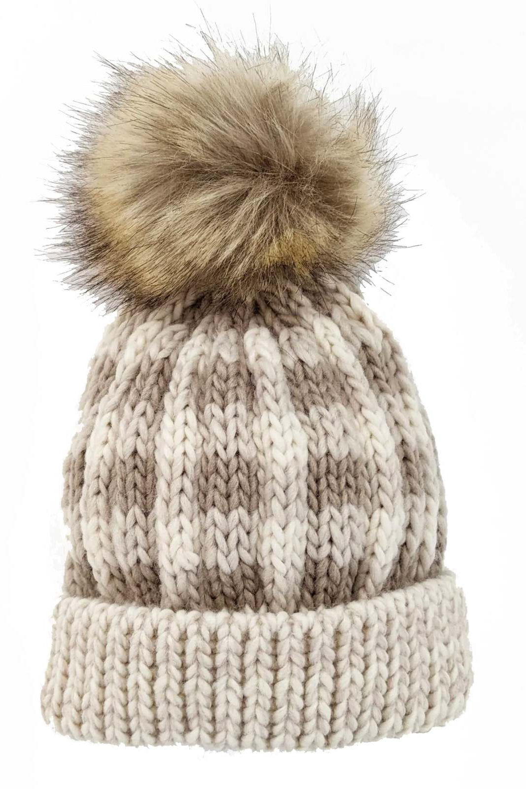 Knitted beanie hat with a faux fur pom-pom, featuring a striped pattern in beige and cream colors.