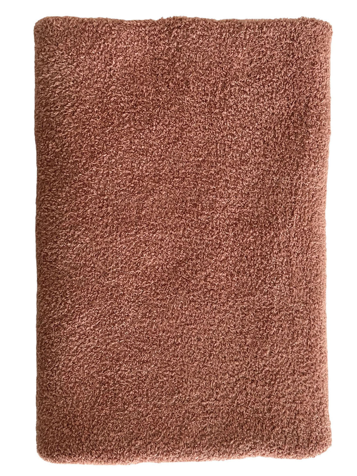 Soft, textured rust-colored towel laid flat on a white background. Ideal for home or spa use.