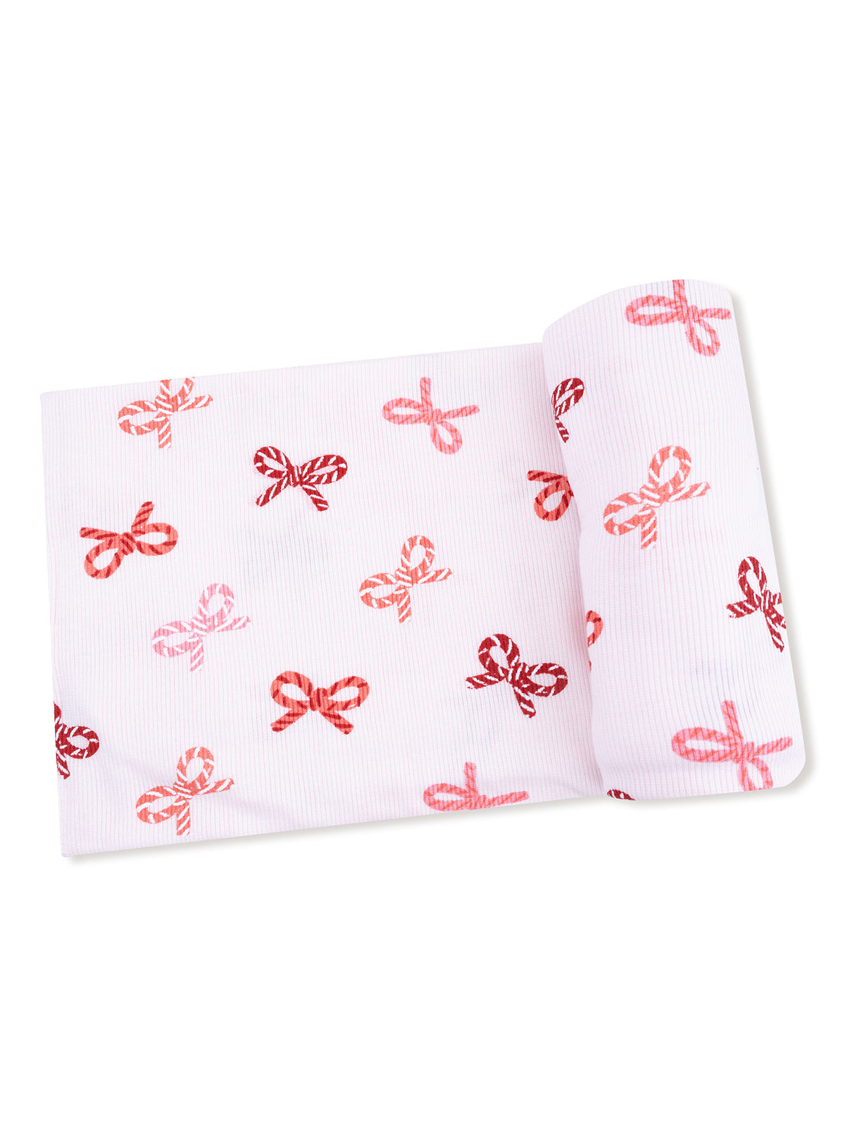 Pink wrapping paper with a pattern of red and white striped bows.