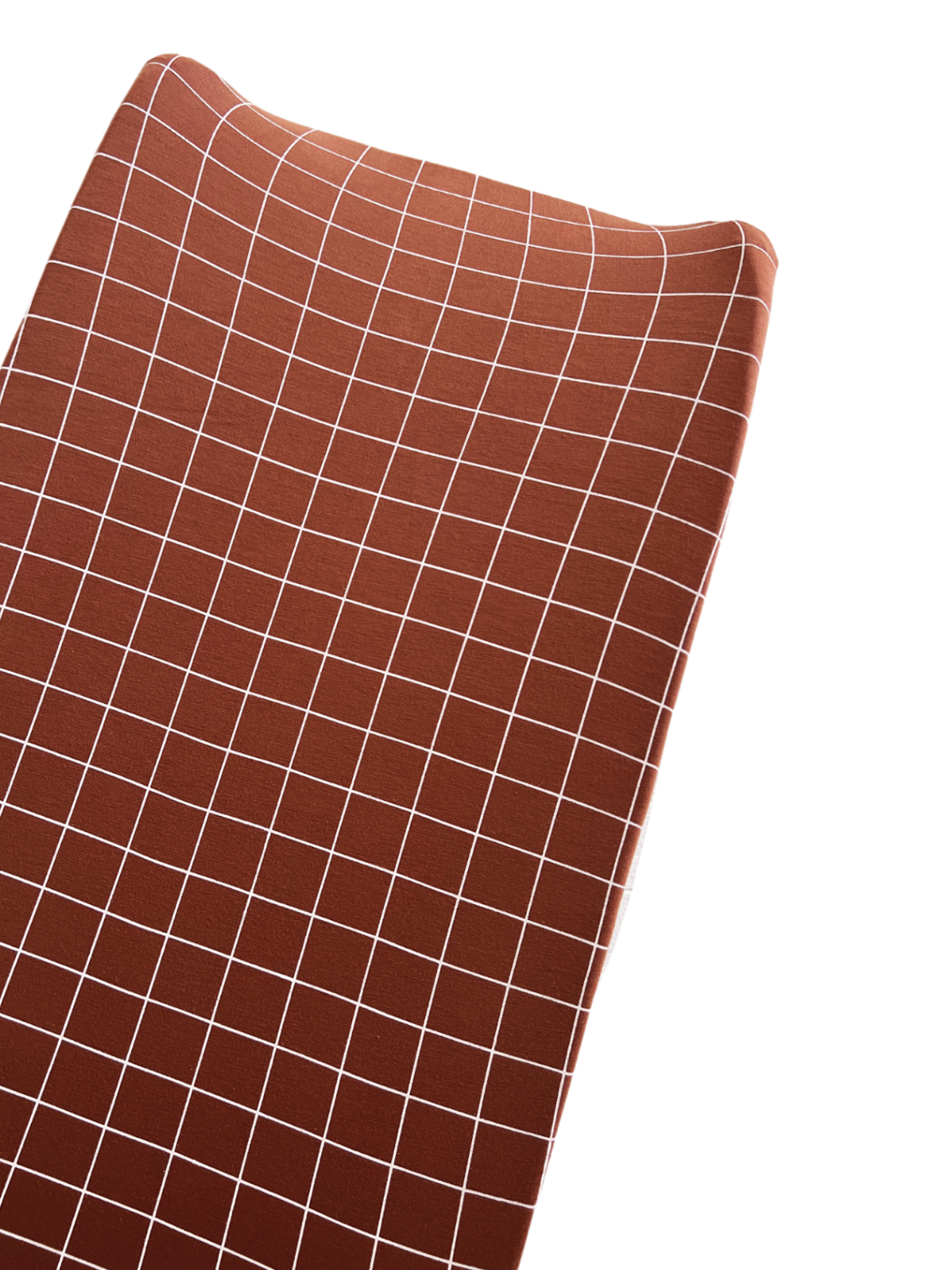 Brown fabric with a white grid pattern, draping smoothly in an angled view.