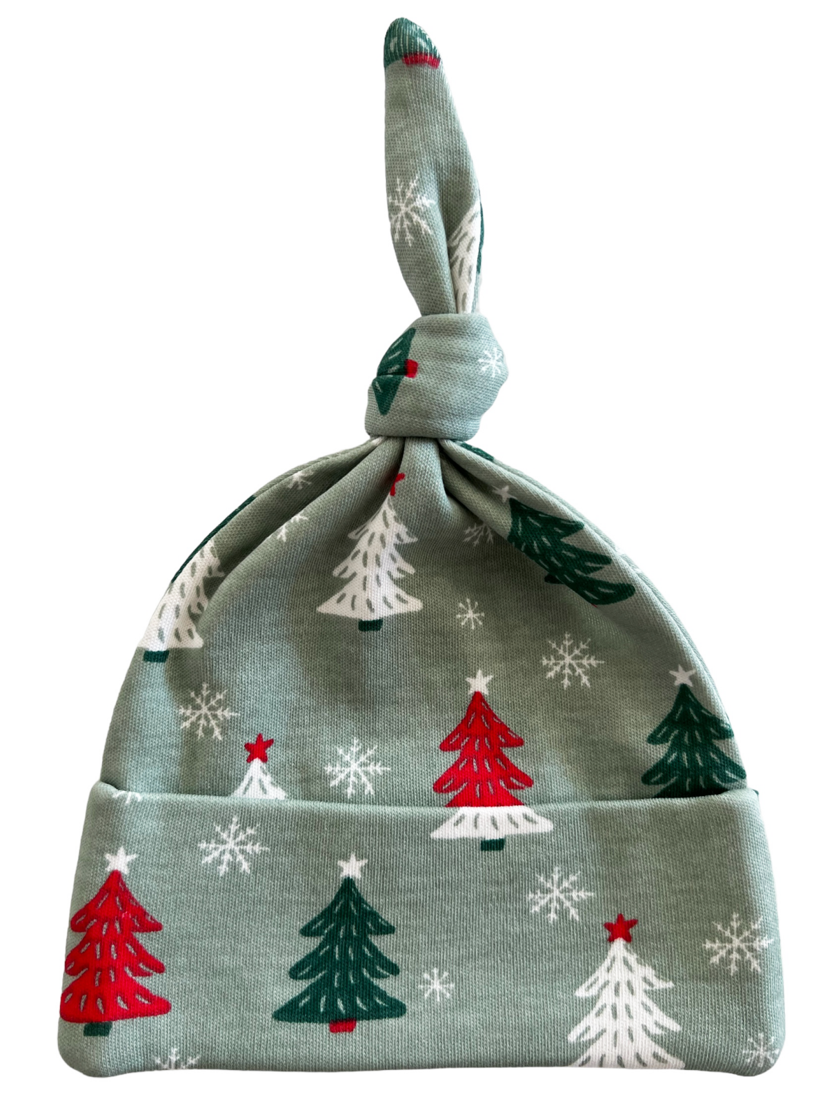 Green holiday baby hat with red and white Christmas trees and snowflakes, featuring a knotted top.