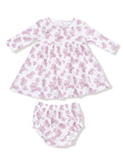 White dress with pink floral pattern and matching bloomers, designed for infants. Soft, comfortable fabric.
