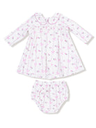 White dress with floral print and matching bloomer, featuring long sleeves and a collar. Perfect for baby girls.