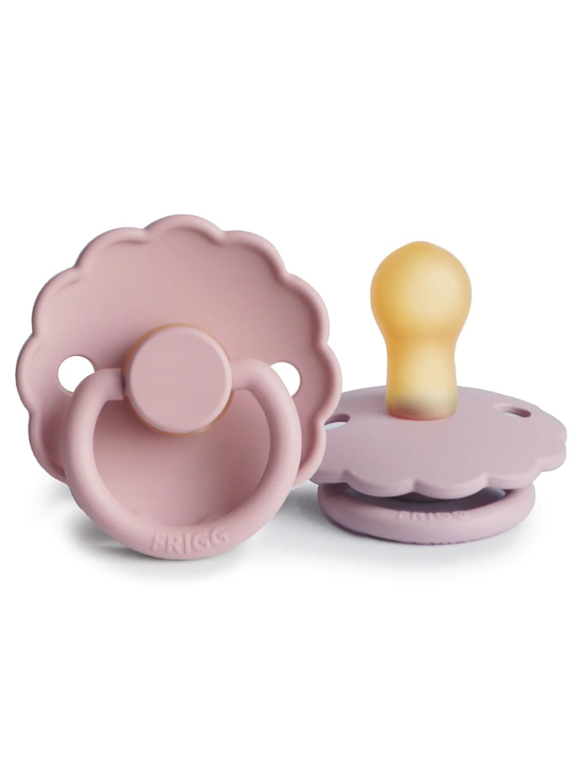 Pink silicone baby pacifiers in a flower shape, one with a round handle and the other upright.