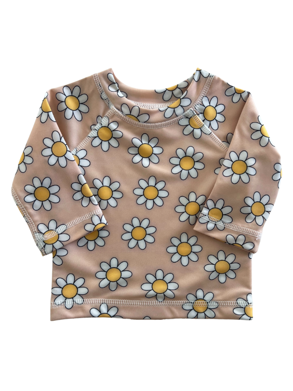 Light pink long-sleeve shirt with a white daisy print and yellow centers, ideal for casual wear or sun protection.