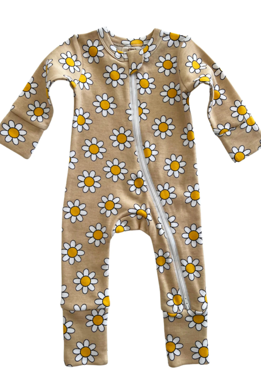 Floral baby onesie with white daisies and yellow centers on a beige background, featuring a front zipper.