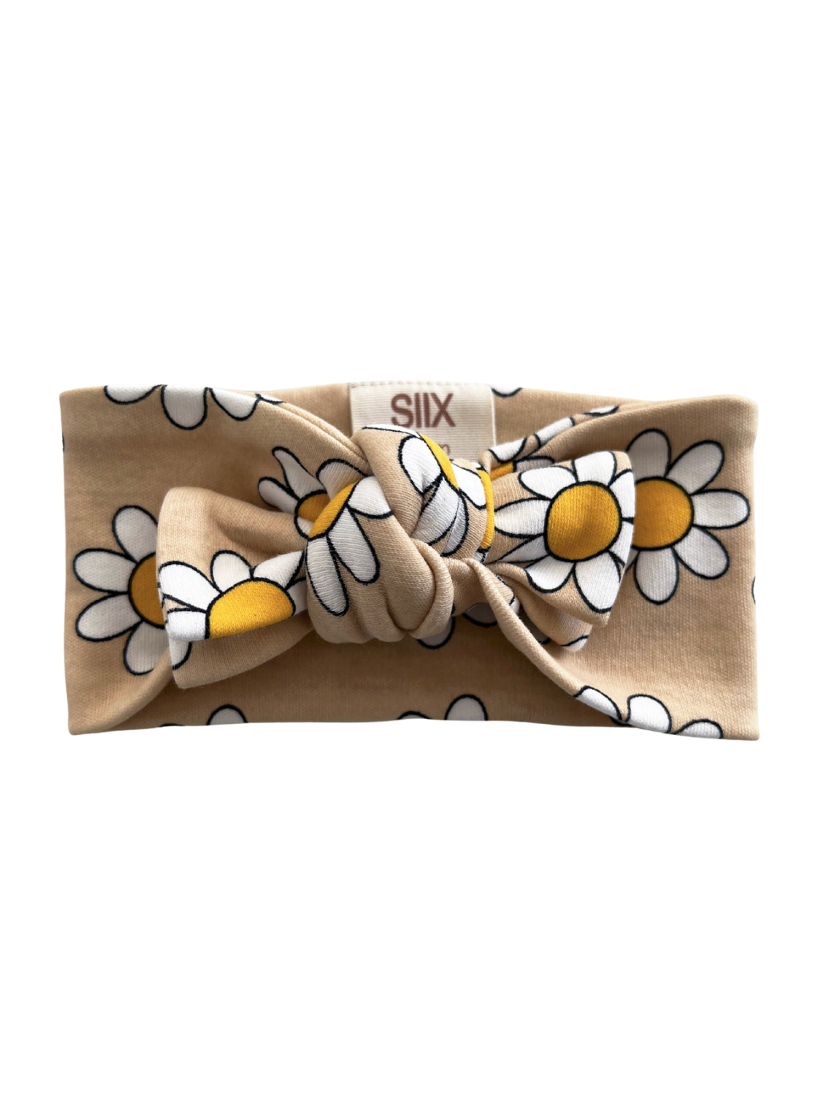 Beige headband with a large bow and white daisies with yellow centers. Text label visible.