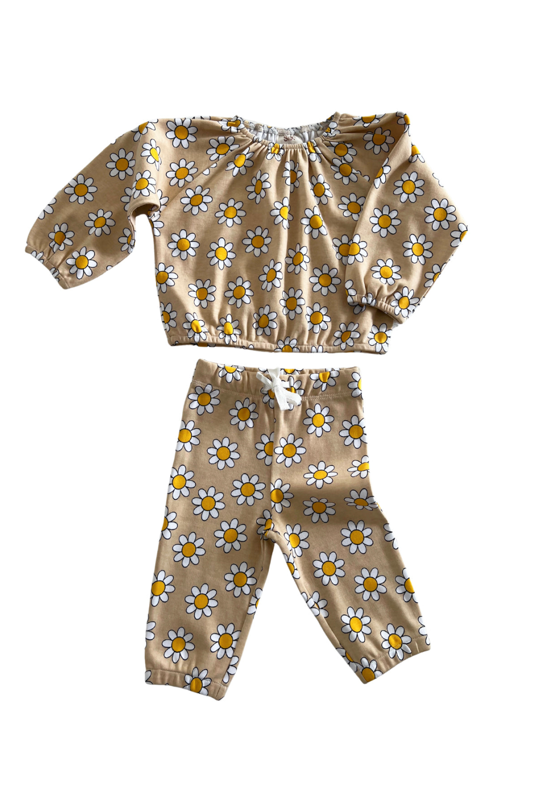 Brown floral children's outfit featuring a long-sleeve top and matching pants with yellow and white daisies.