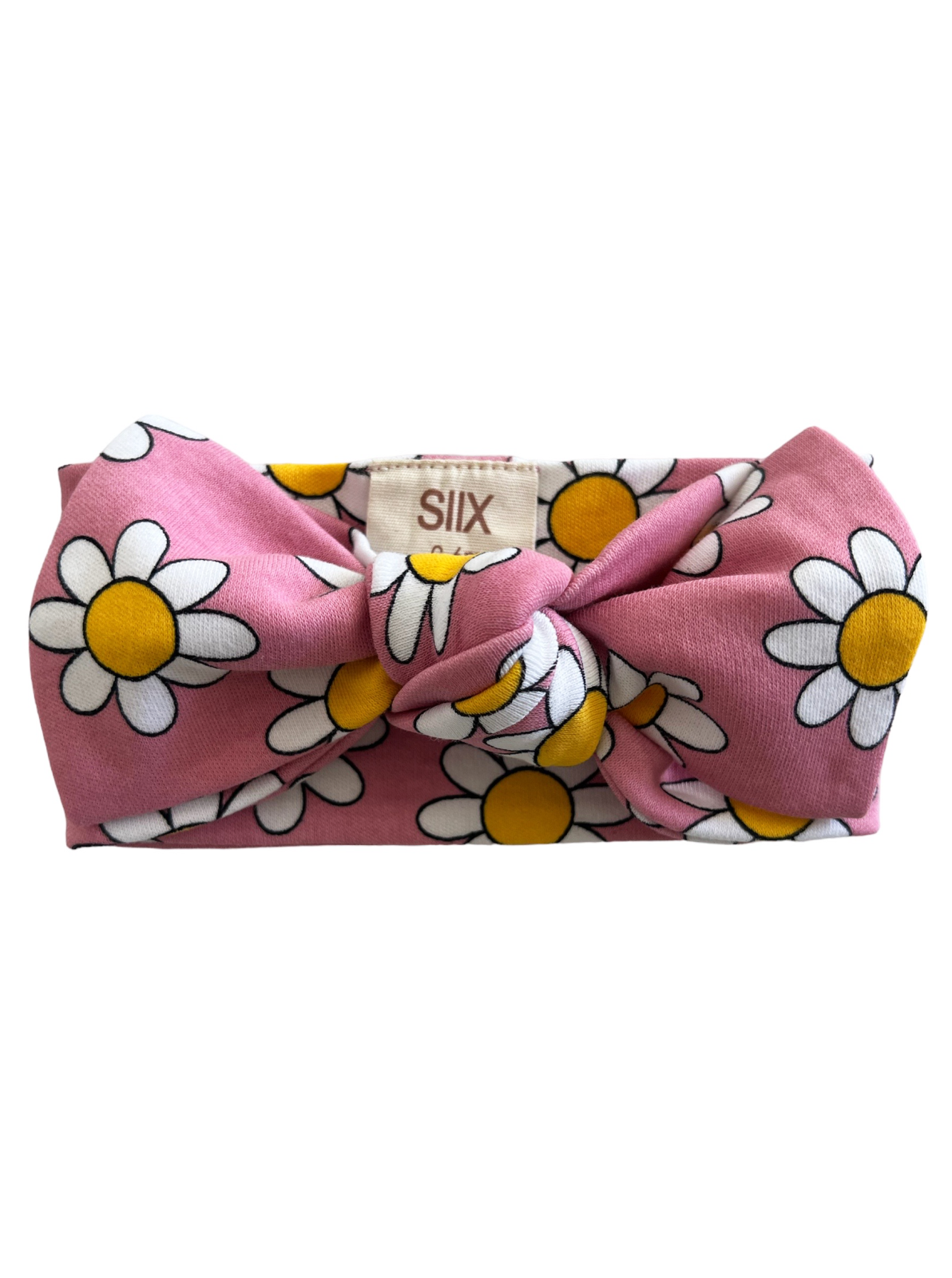 Pink headband with a large bow, featuring a white and yellow daisy pattern.