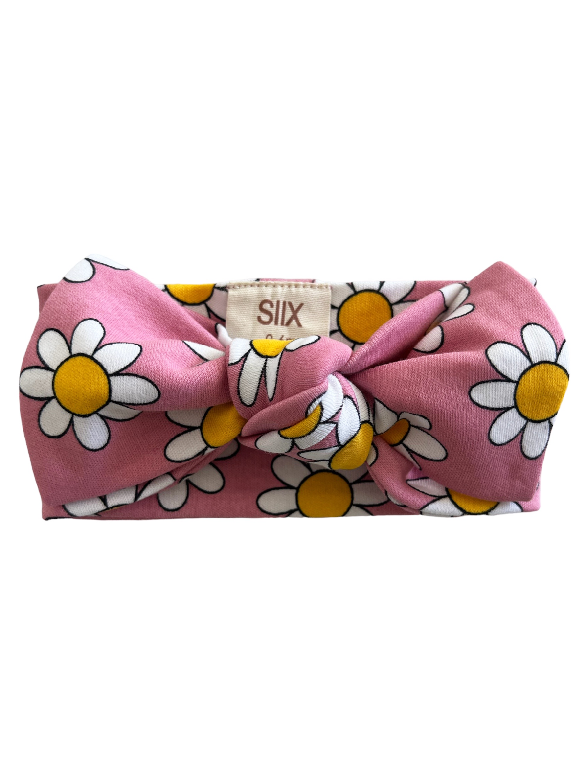Pink headband with a large bow, featuring a white and yellow daisy pattern.