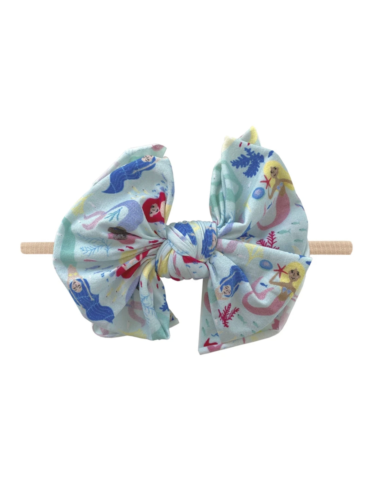 Colorful mermaid-themed hair bow with light blue fabric and a wooden clip. Perfect for kids' accessories.
