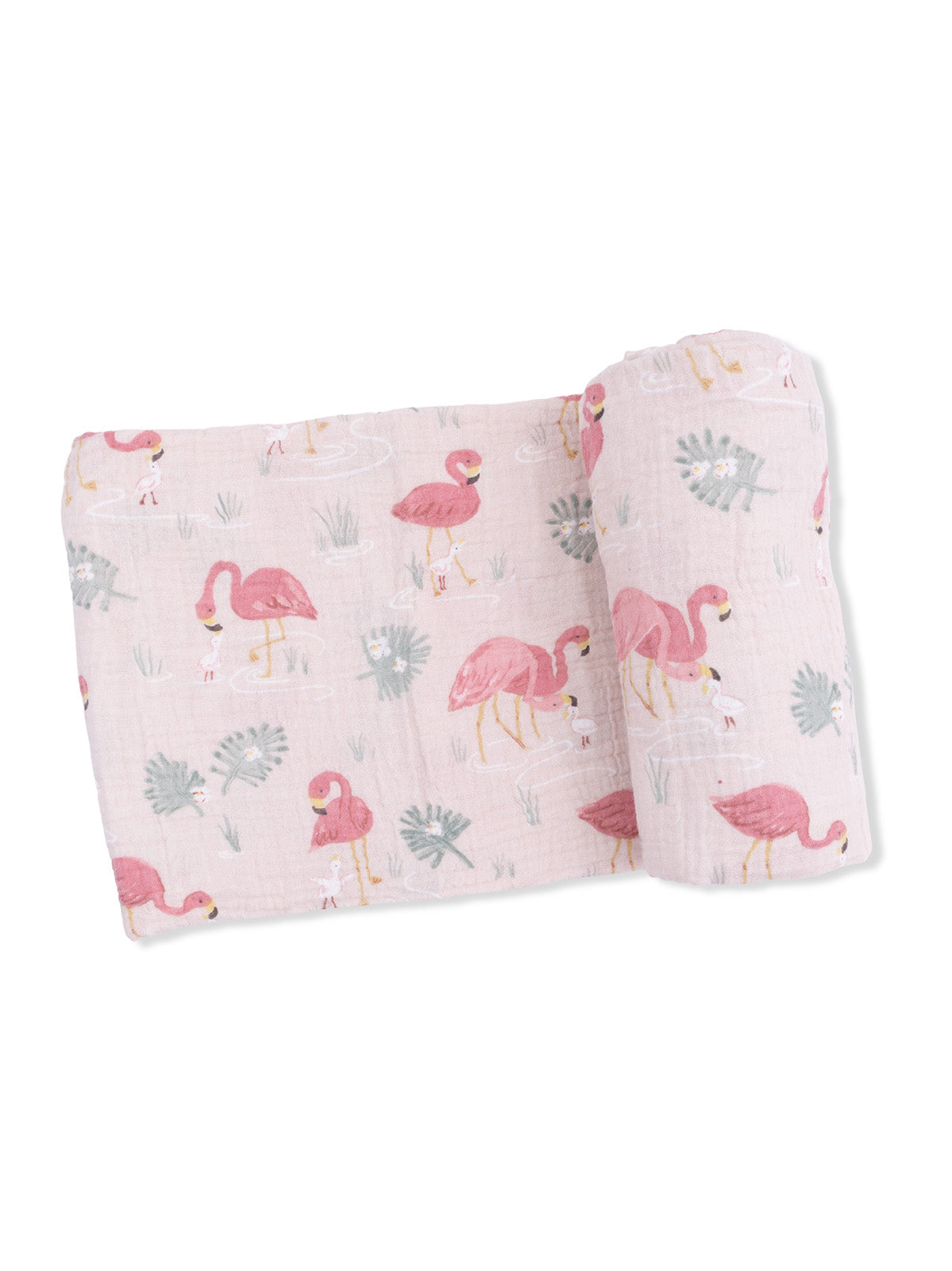 Light pink muslin blanket with flamingo and tropical leaf patterns, rolled neatly for display.