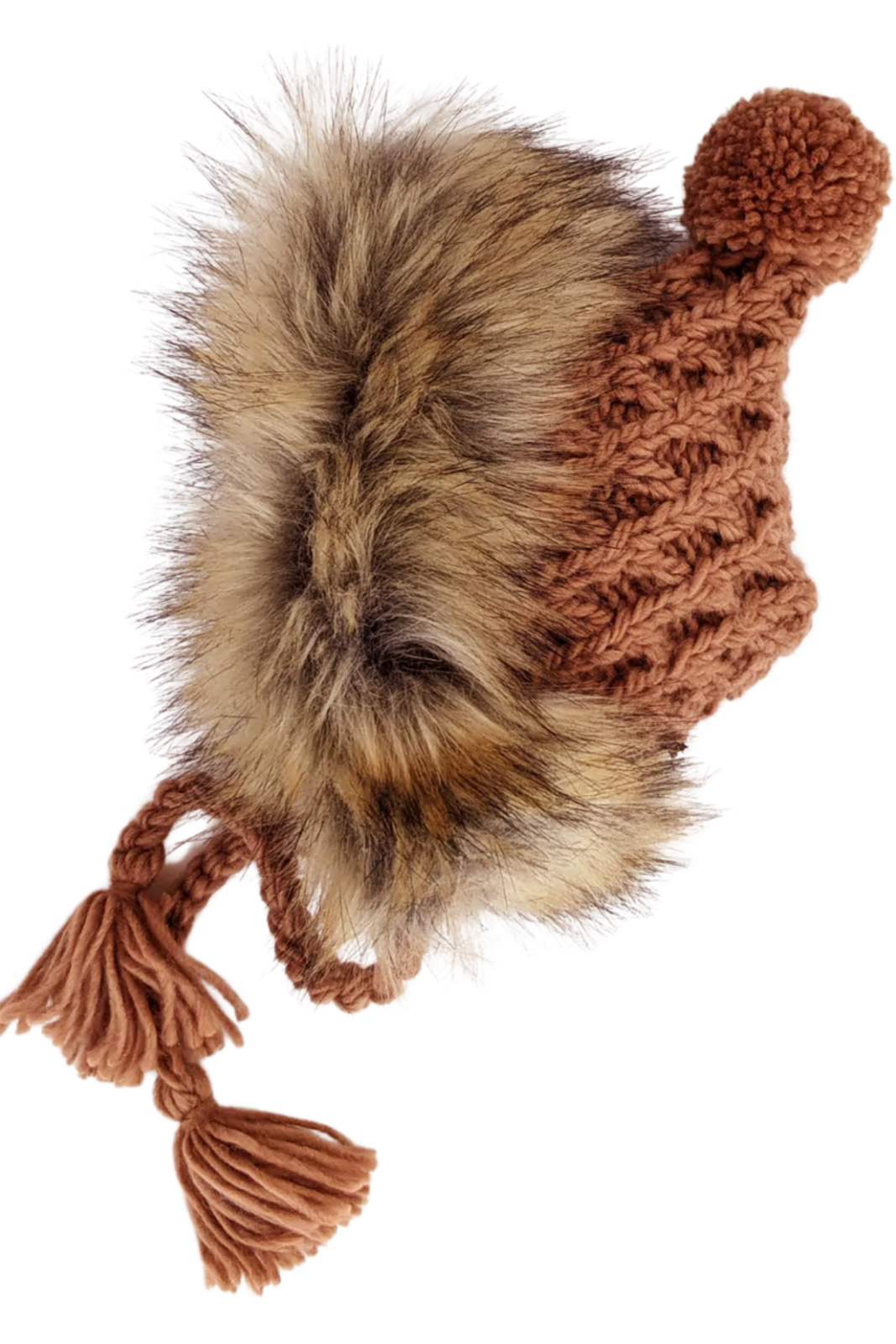 Knitted brown hat with faux fur trim and a pom-pom, featuring tassels on the sides.