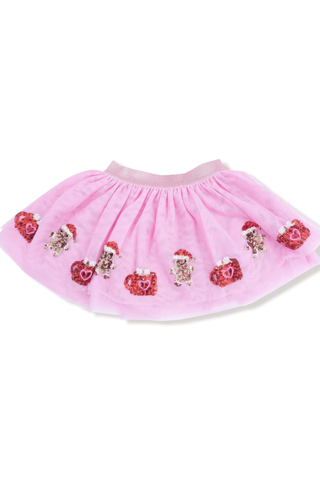 Pink tulle skirt adorned with sequin hearts and gingerbread decorations. Perfect for festive occasions.