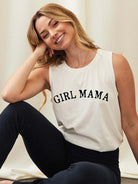 Smiling woman in a sleeveless shirt with "GIRL MAMA" text, seated against a light background.