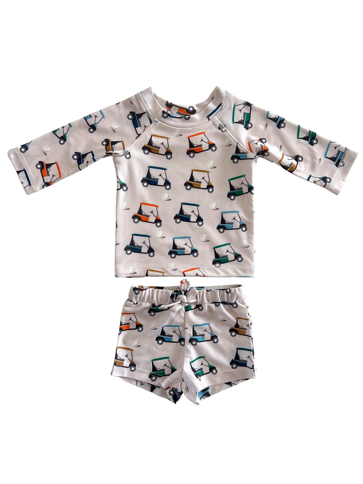 Children's swim set with golf cart print; includes long-sleeve top and matching shorts.