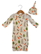 Baby outfit featuring a ribbed gown with bunny, carrot, and egg patterns, paired with a matching knot hat.