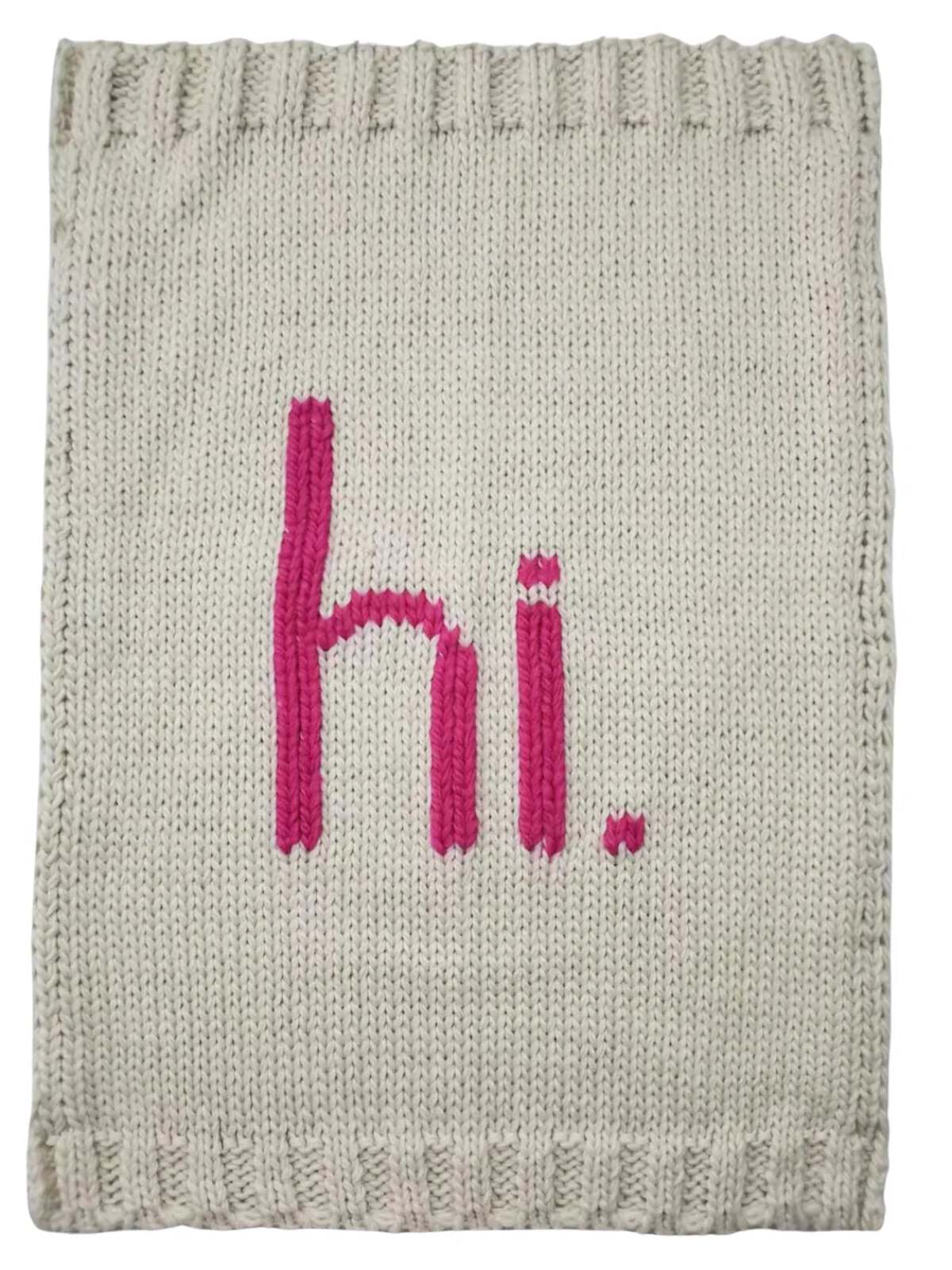 Knit blanket with the word "hi." in pink against a light gray background.