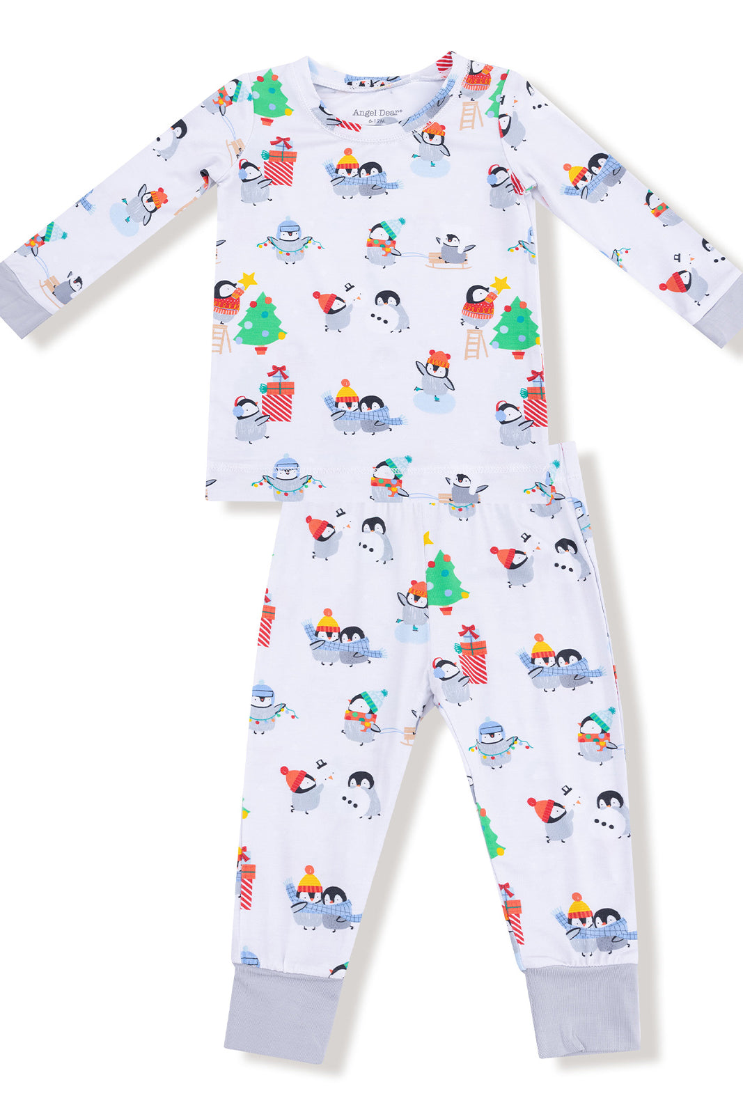 Children's winter pajamas featuring cute penguins, snowmen, and festive decorations on a light background.