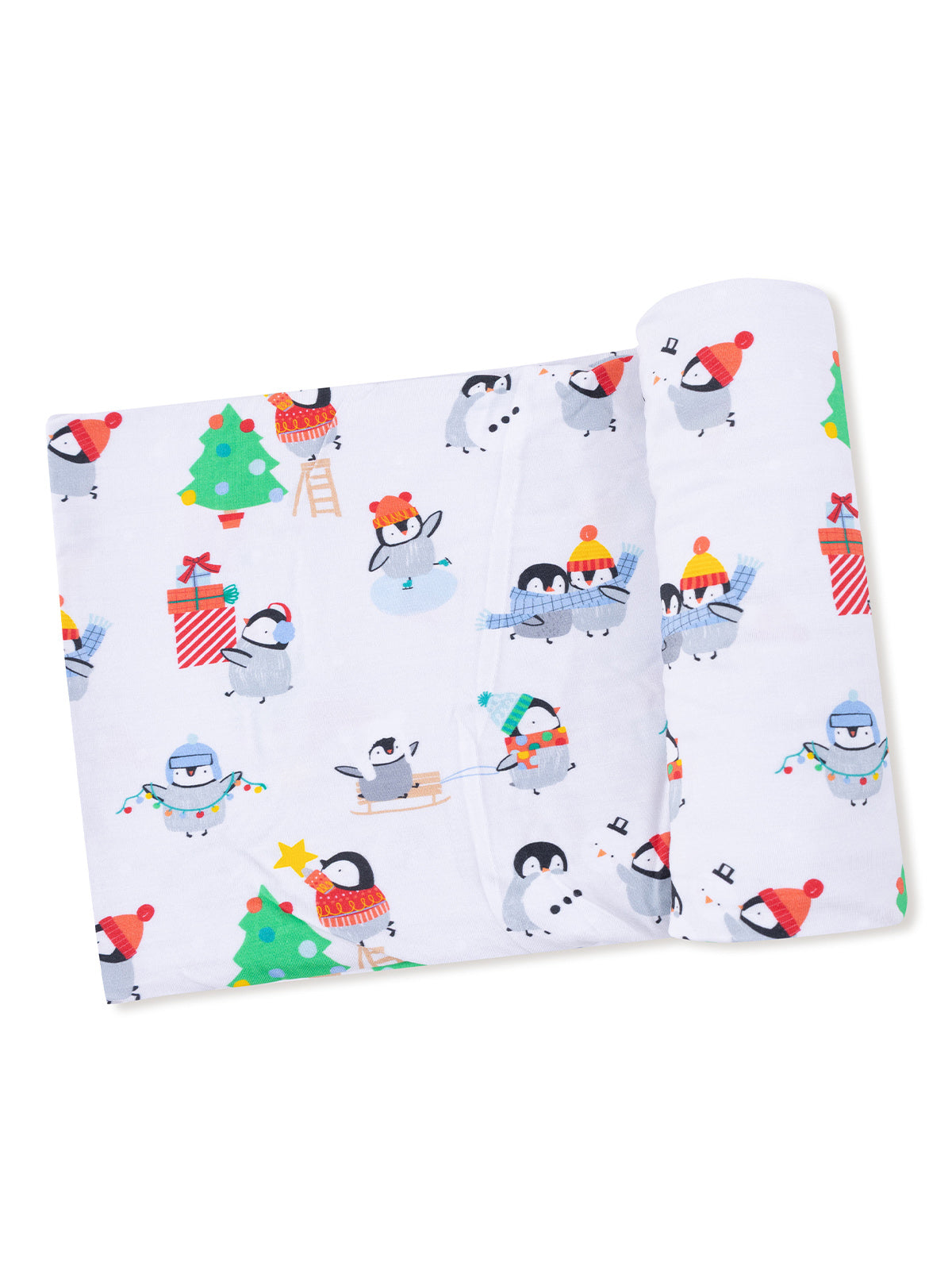 Penguin-themed fabric with festive decorations, including trees, gifts, and snowmen, rolled up for display.