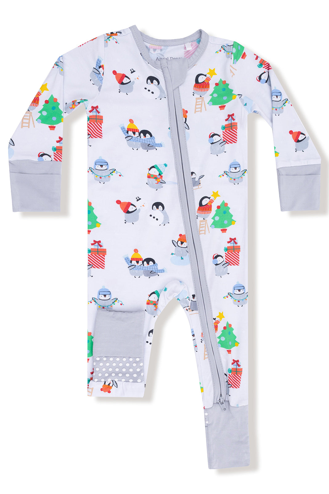 Child's festive pajama onesie with penguins, snowmen, and Christmas trees in cheerful colors.