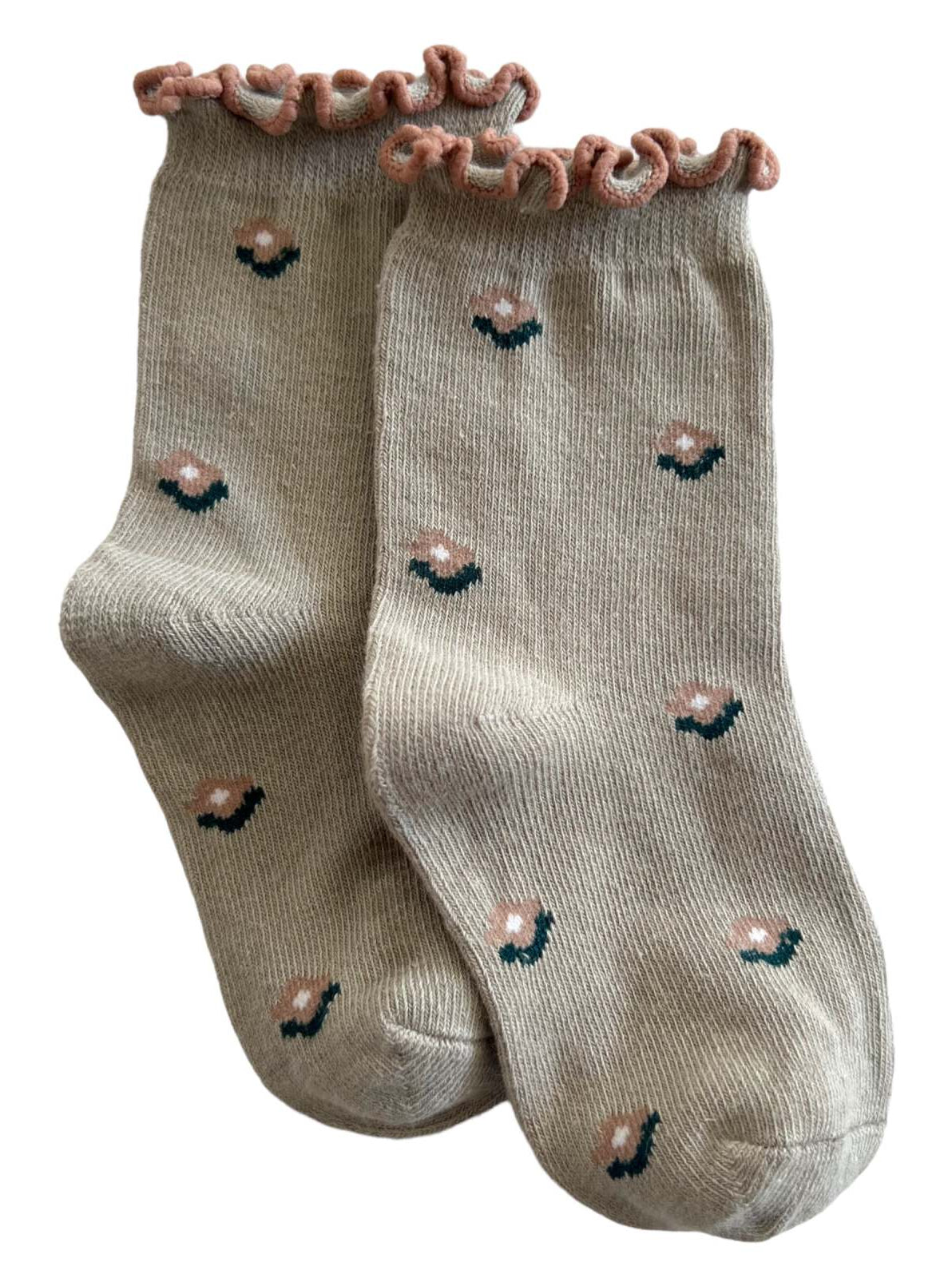Beige socks with a pink ruffled top and floral designs in pink and green.