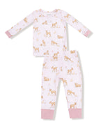 Girls' pajama set featuring pink and cream patterns of deer and rabbits on a soft fabric.