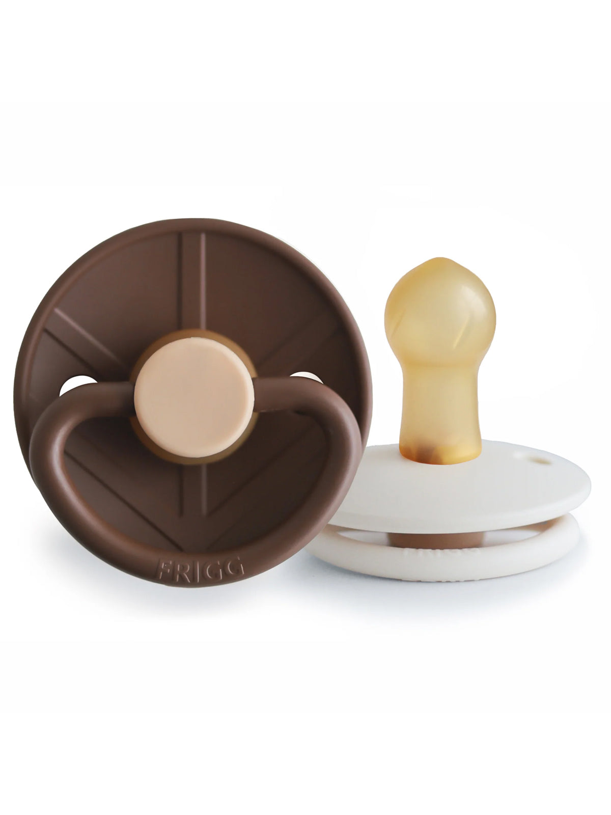 Brown and white baby pacifiers with a silicone nipple and round shield design.