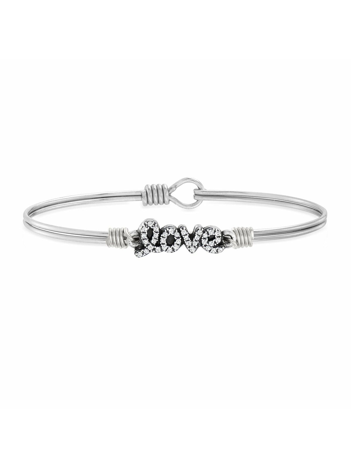 Silver bracelet featuring the word "love" adorned with sparkling accents. Elegant and stylish accessory.