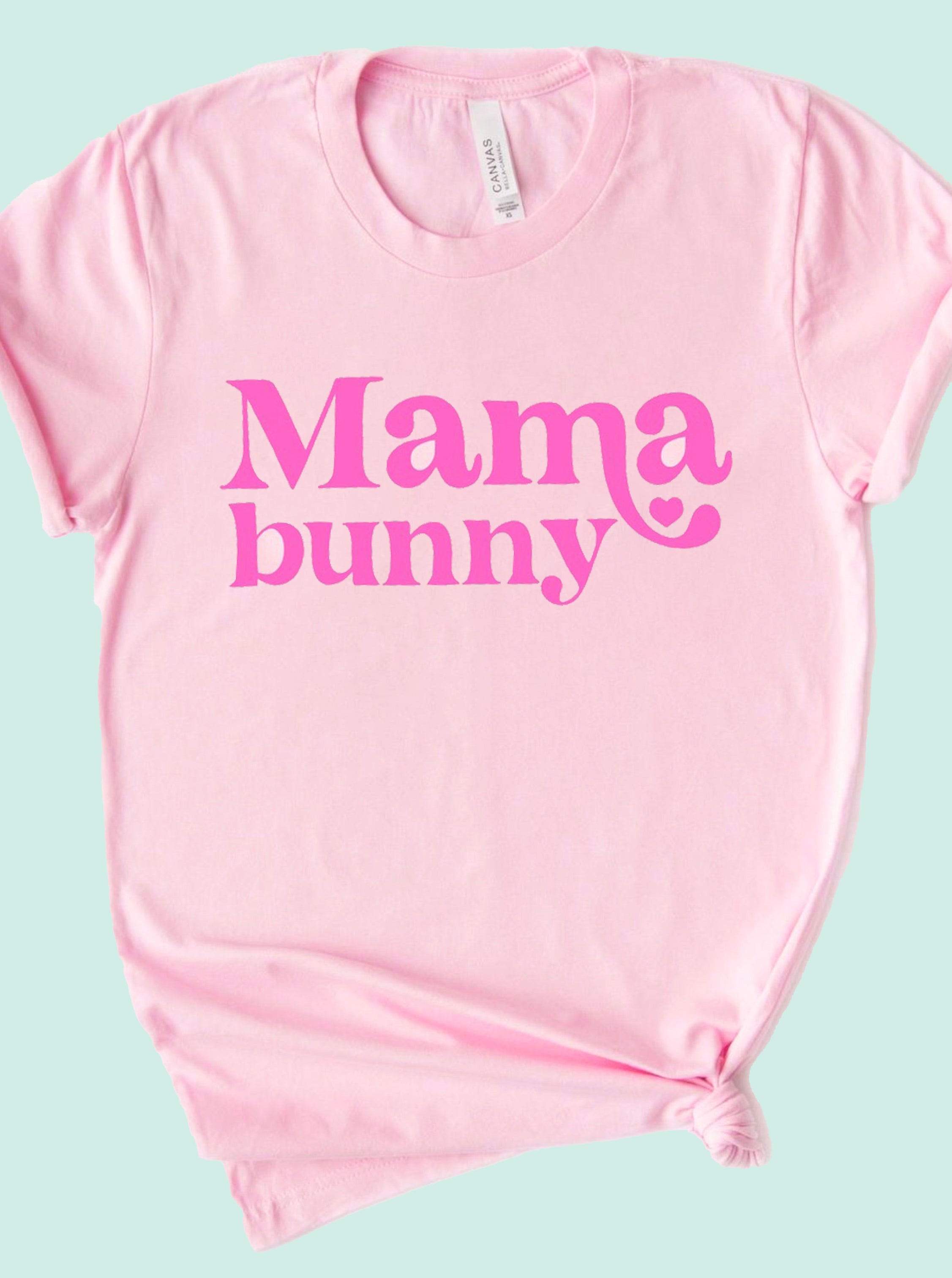 Pink t-shirt with "Mama bunny" printed in bold, playful typography. Perfect for casual wear.