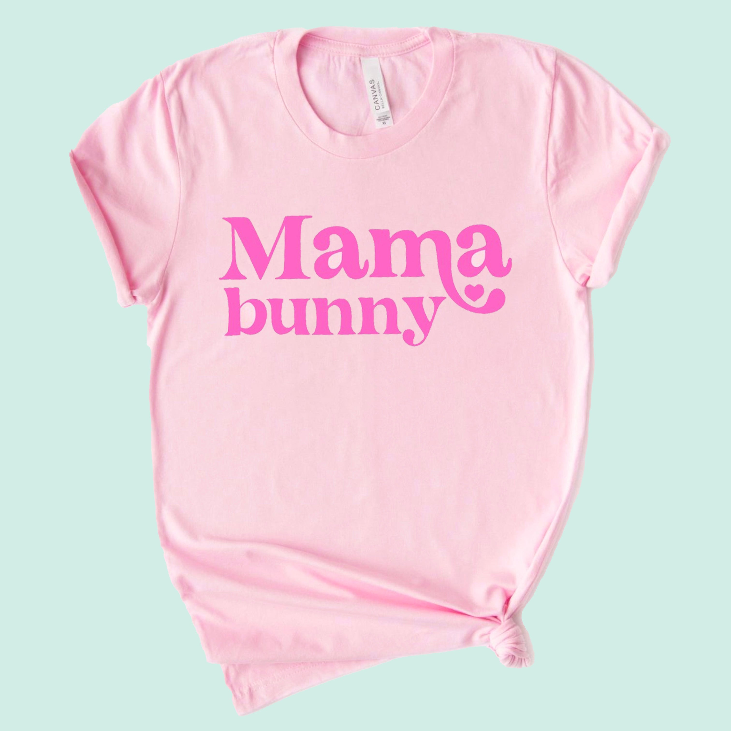 Pink t-shirt with "Mama bunny" printed in bold, playful typography. Perfect for casual wear.