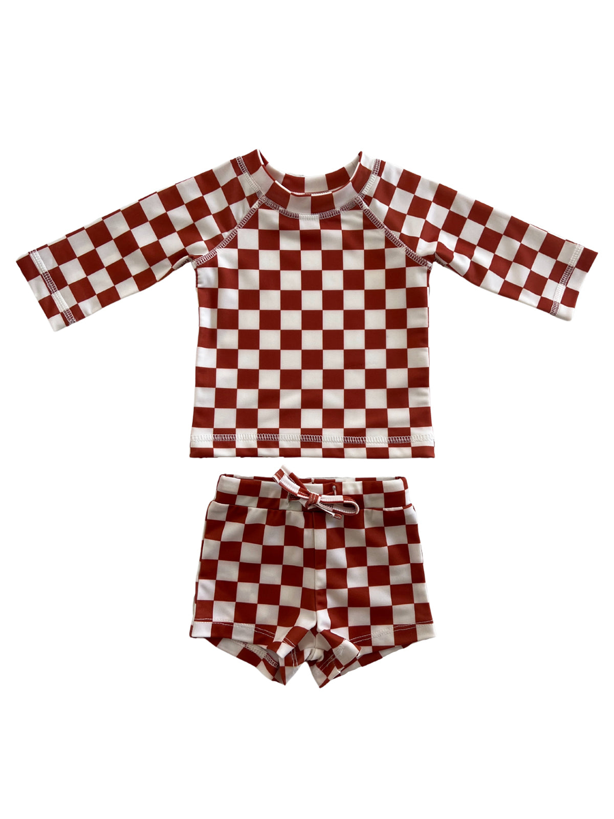 Red and white checkered swim set for kids, featuring a long sleeve top and matching shorts.